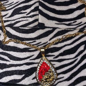 Beautiful gold necklace with red gems